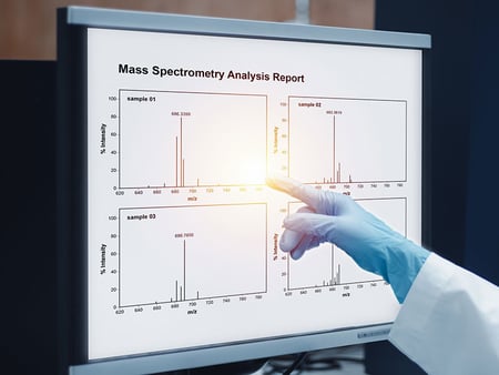 Scientist-indicates-the-chromatogram-of-mass-spectrometry-analysis-results-of-compounds-as-shown-on-the-computer-monitor-of-mass-spectrometer